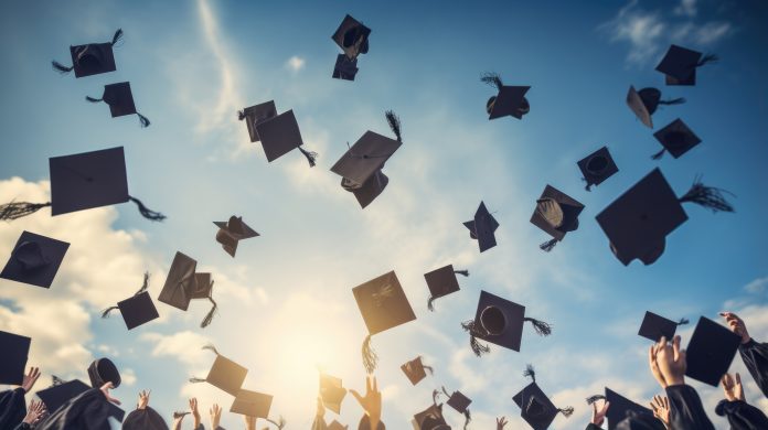 Students throwing graduation caps