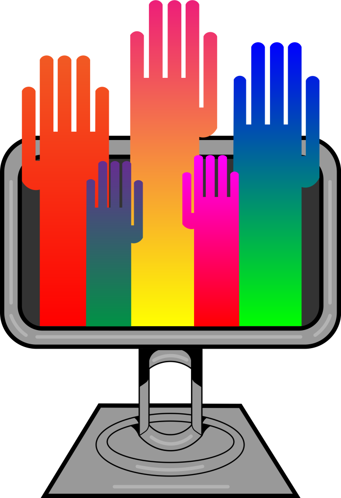 Colored hands rising from computer monitor