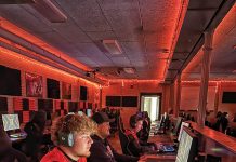 Rise of Collegiate Esports in North Dakota Esports competitors at computer stations